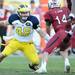 Michigan linebacker Desmond Morgan eyes South Carolina quarterback Connor Shaw during the second half of the Outback Bowl at Raymond James Stadium in Tampa, Fla. on Tuesday, Jan. 1. Melanie Maxwell I AnnArbor.com